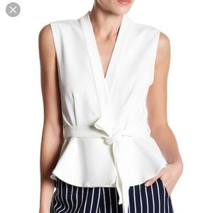 Lucy Paris white peplum top. Size small